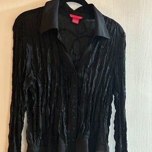 Black on black long sleeve blouse with ruffles in lower front and on sleeves